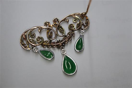 A 1920s yellow metal, diamond and jadeite set drop openwork scroll brooch, width 38mm.